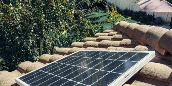 A black solar panel on a roof